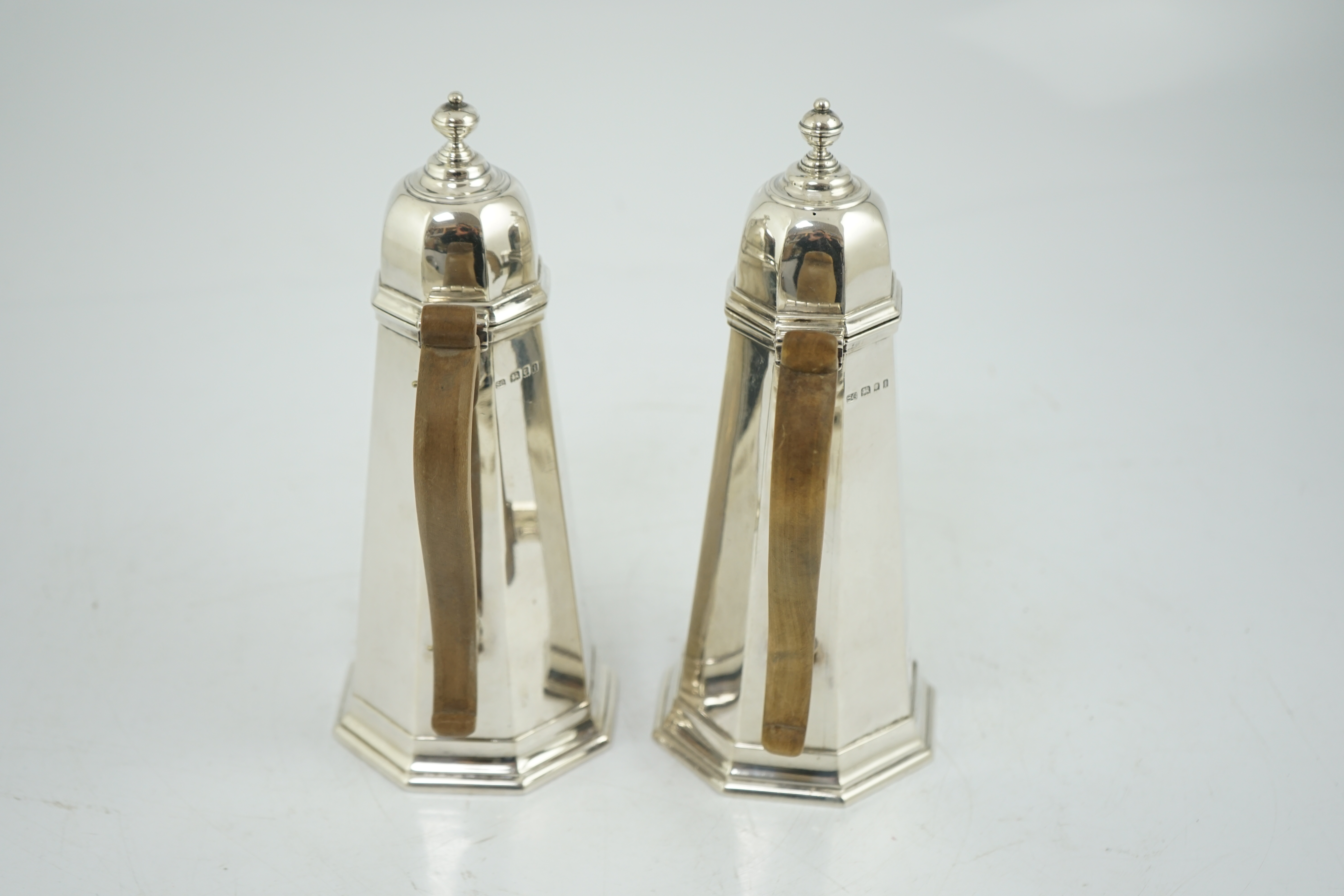A George V 18th century style silver cafe au lait pair by Garrard & Co